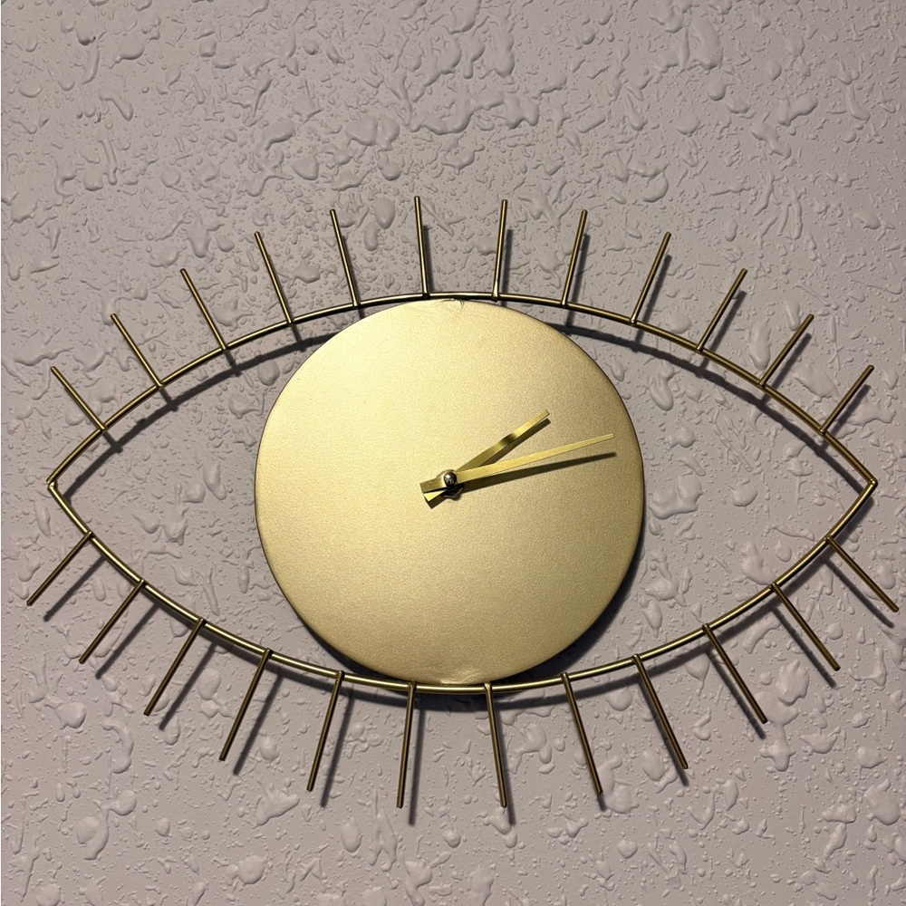 Elegant Gold Eye Wall Clock